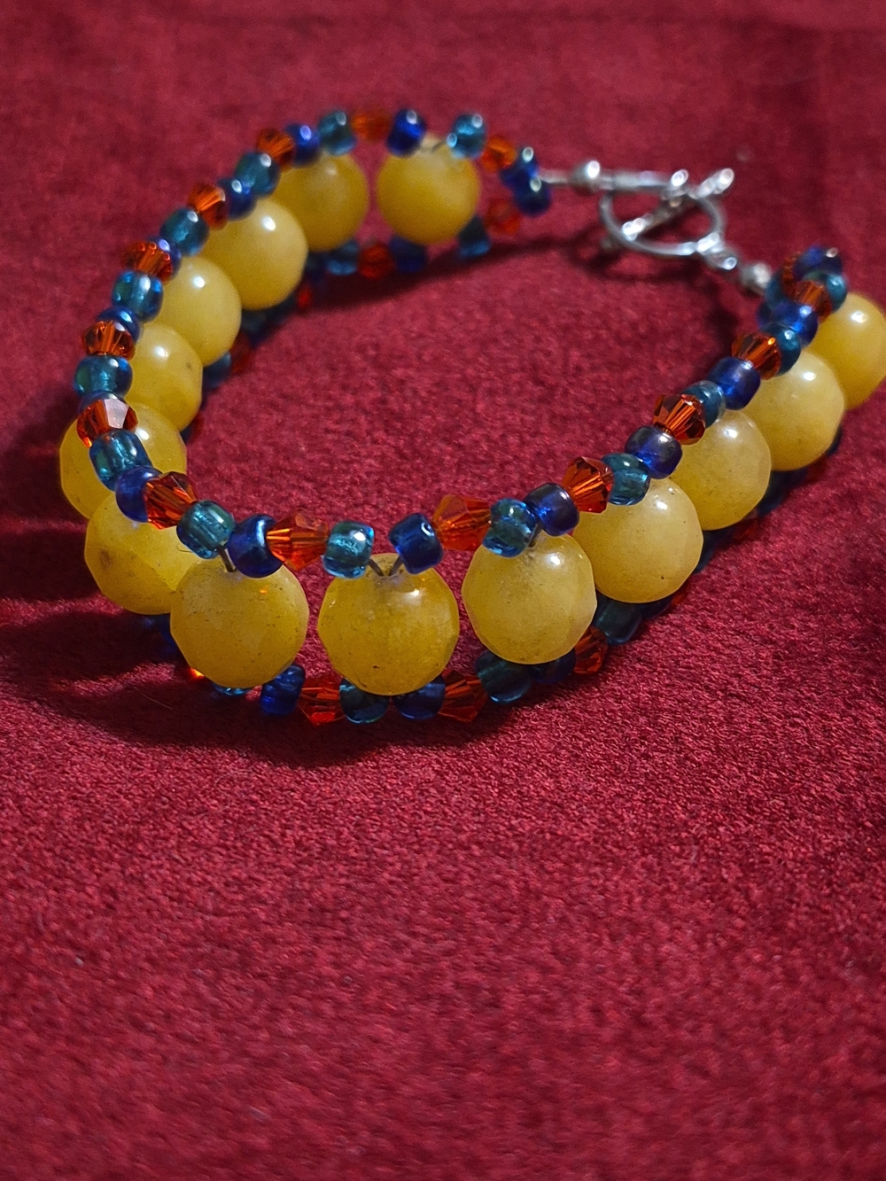 Handmade Unisex Yellow Beaded Bracelet with Blue and Orange Accents